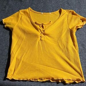 A yellow mid crop shirt